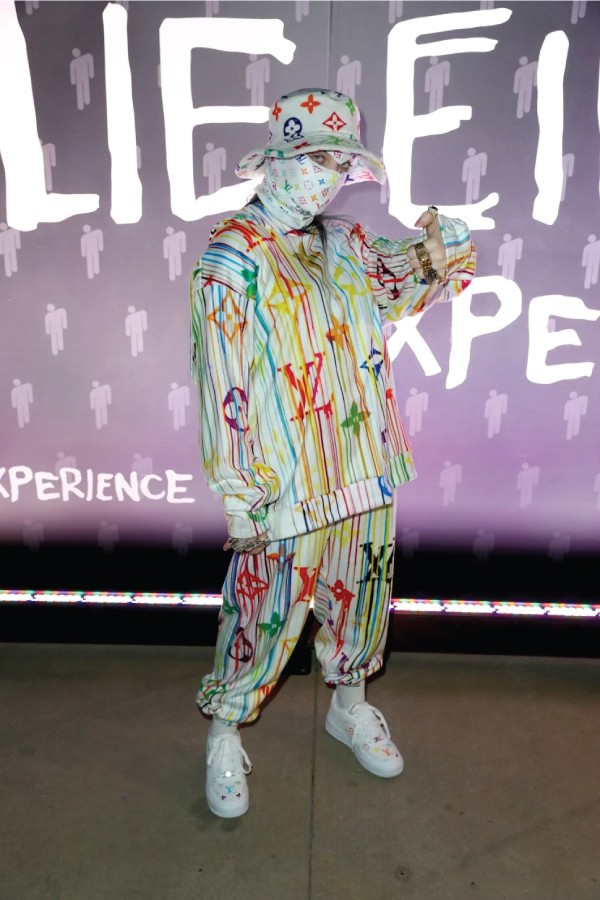 Best Runway Moments. Billie Eilish in a full Louis Vuitton print outfit and face mask.