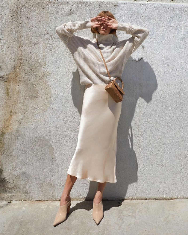 Fall Skirt Trends You Will Want To Wear Everyday: beige slip skirt.