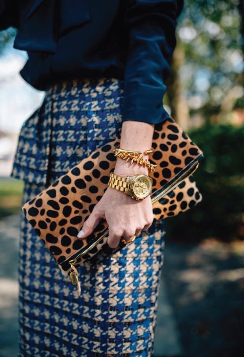 The Fall Trend Looks You Will Want To Show Off On Instagram. A blue print skirt and brown polka dot pouch.