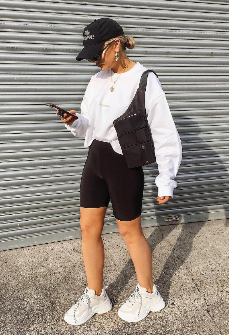 The Fall Trends You Will Want To Show Off On Instagram. Biker shorts with sweater tucked in and chunky sneakers.