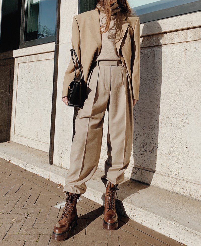 The Fall Trend Looks You Will Want To Show Off On Instagram. All neutral outfit, with a beige suit and beige shirt, with brown army boots.