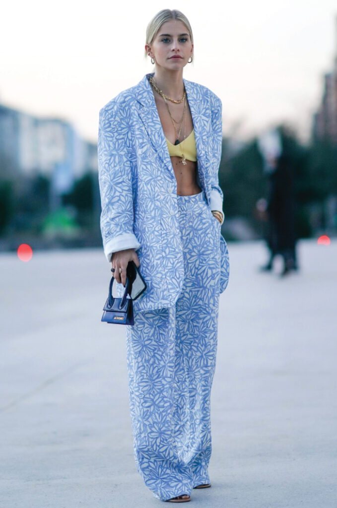Colourful Suits To Elevate Your Street Style. Blue pants suit with a flower pattern.