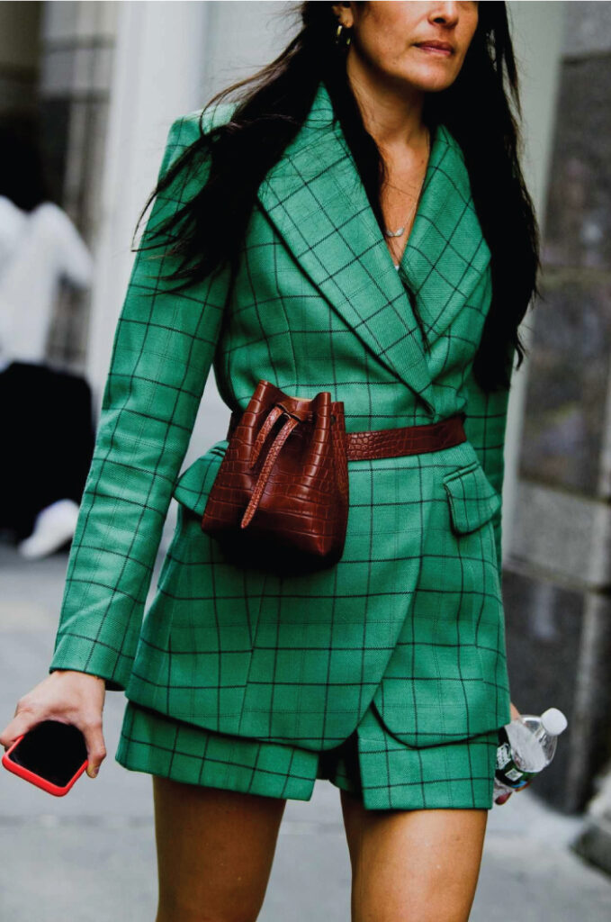 Colourful Suits To Elevate Your Street Style. Green shorts suit with black stripes.
