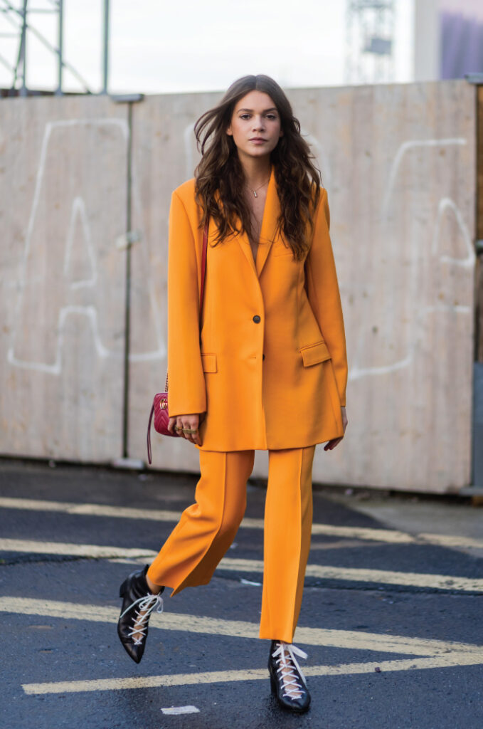 Colourful Suits To Elevate Your Street Style. Orange pant suit.