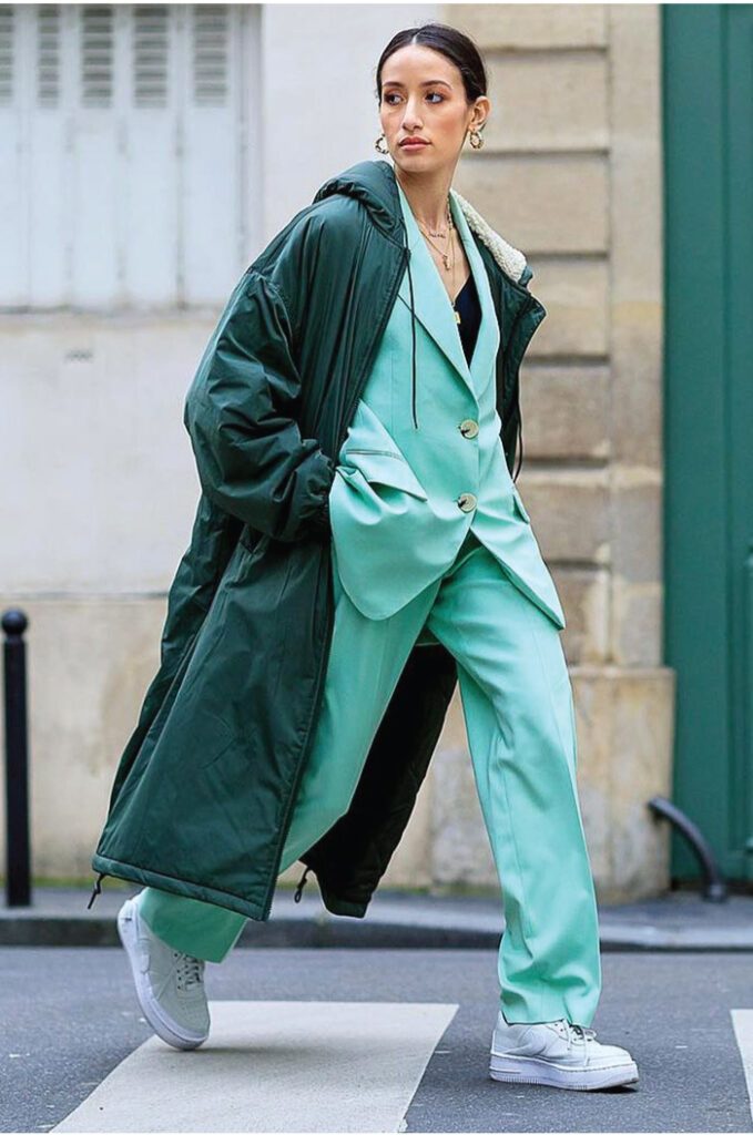 Colourful Suits To Elevate Your Street Style. Mint green pant suit with white sneakers.