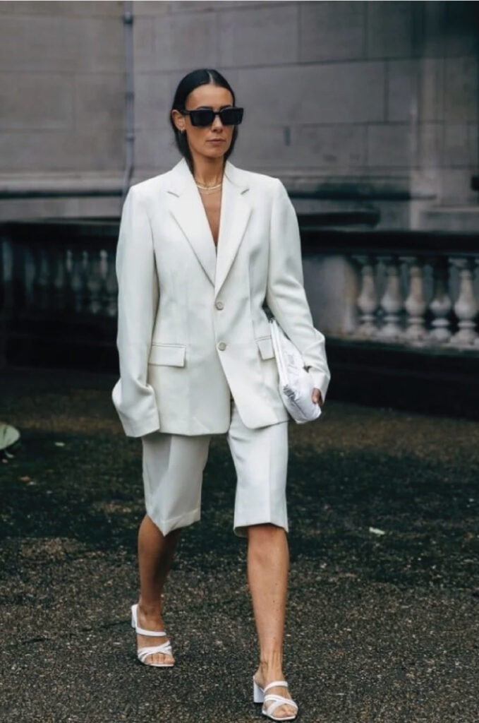 Colourful Suits To Elevate Your Street Style. White shorts suit with white strappy heels.