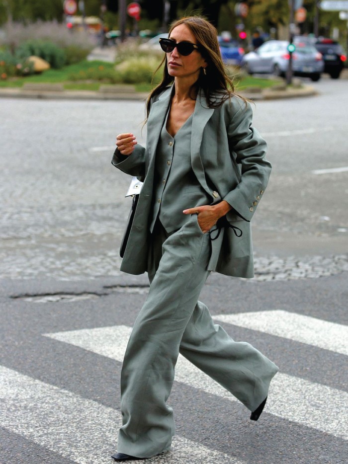 The 2021 Fashion Trends You Need To Watch Out For. Androgynous tailoring: an amazing green pant suit and heels.