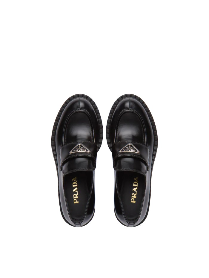 Trends to wear with jeans: chunky loafers. Chunky loafers from Prada.