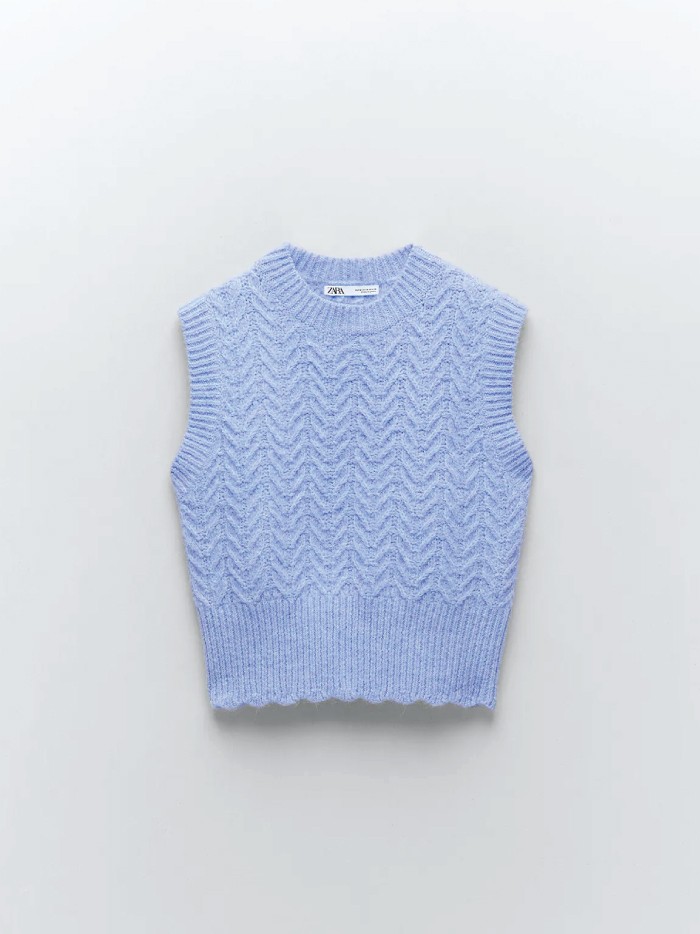 Trends to wear with jeans: sweater vests. Blue sweater vest from Zara.