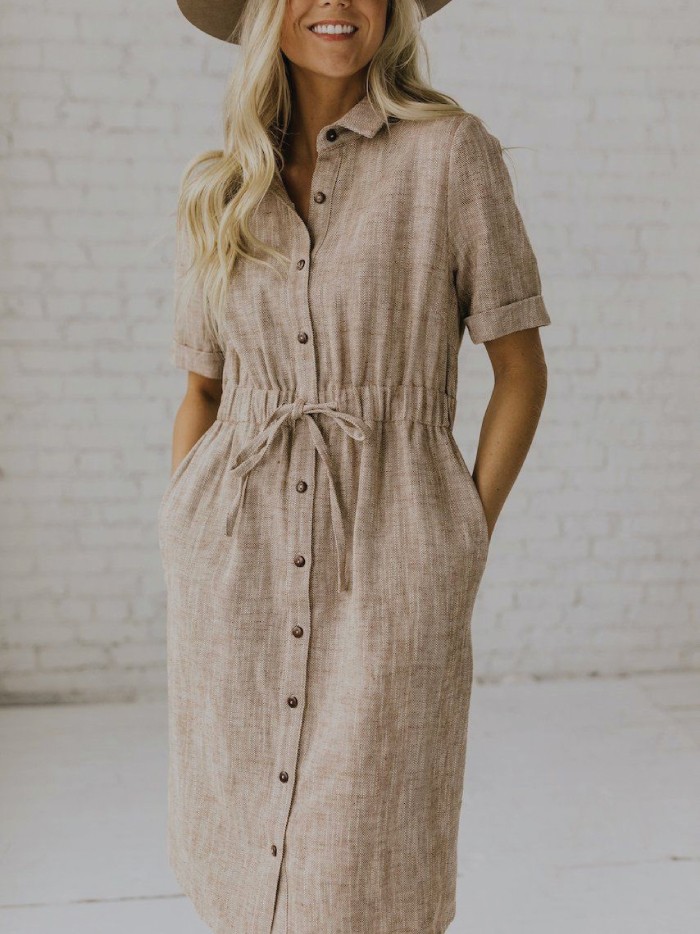Dress Trends That French Women Are Bringing Back. Button-up dress in beige.