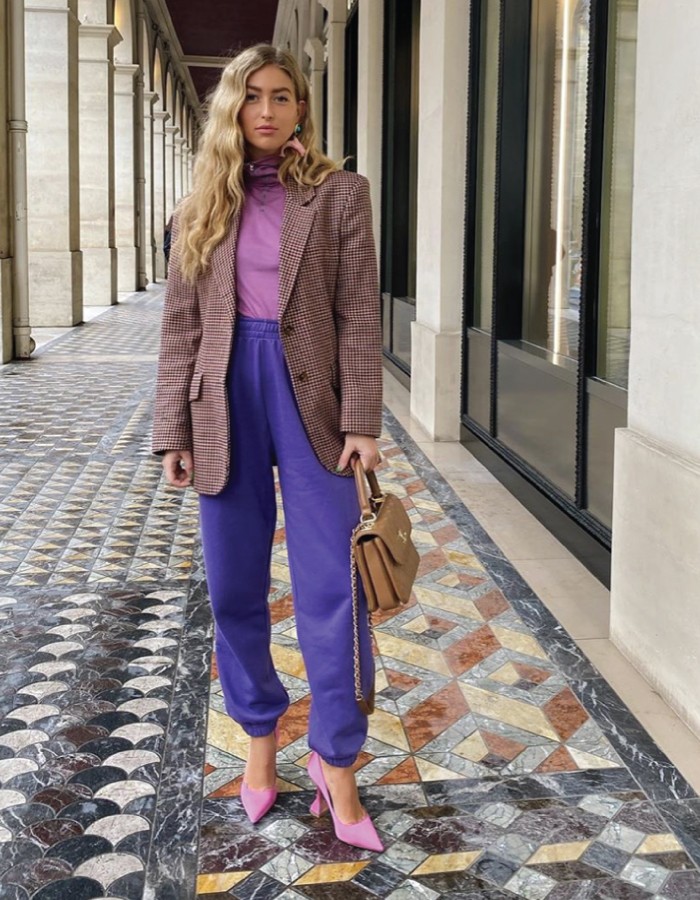 The Best Jeans Alternatives For When You Are Tired Of Wearing Denim. Purple joggers and pink sweater, with blazer and heels.