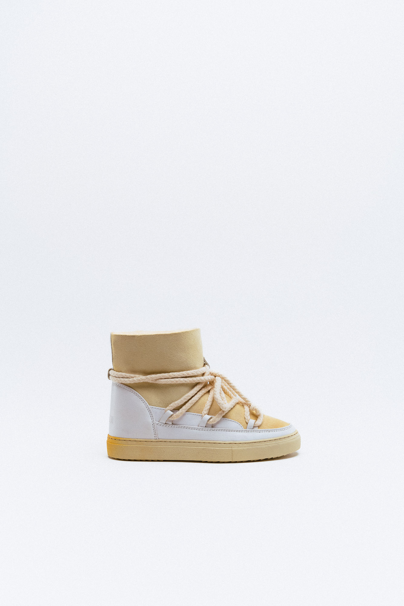 High sneaker in white and cream colors, product specifications.