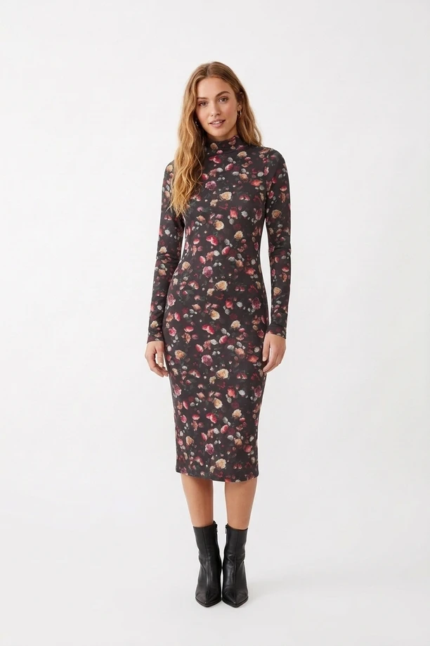 Model in dark floral long-sleeve mock-neck bodycon midi dress and black leather boots.