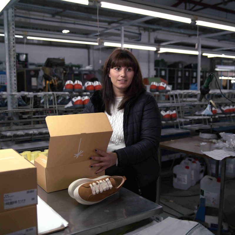 Portugal Shoes worker doing the quality control in at the factory.